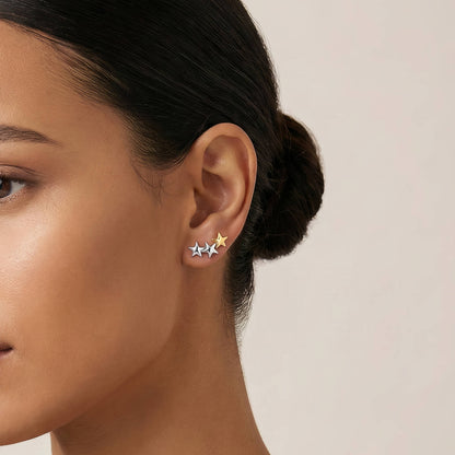 Stjerneøredobber – Elegant kontrast i gull og sølv